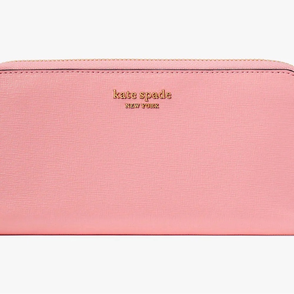 KATE SPADE ZIP AROUND WALLET. IN VERY GOOD CONDITIONS.NO CALL OUTS. VERY CLEAN.